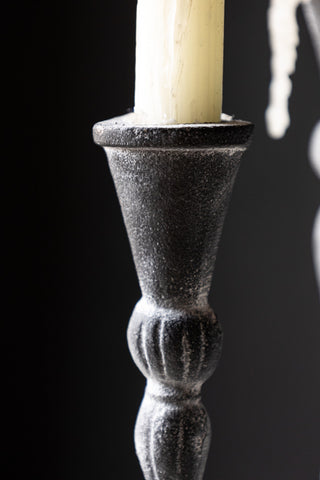 Detail shot of the top of the Short Black Antique Zinc Style Candlestick Holder with a candle inside.