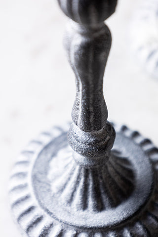 Detail shot of the stem and base of the Short Black Antique Zinc Style Candlestick Holder.