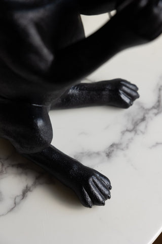 Close-up of the feet on the Quirky Black Dog Lamp.