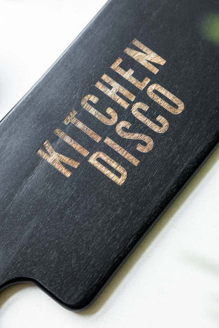 Close-up of the text on the Black Kitchen Disco Slim Serving Board.