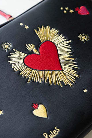 Close-up of the design on the Black Milagro Heart Laptop Case.