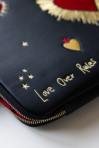 Detail shot of the text on the Black Milagro Heart Laptop Case.