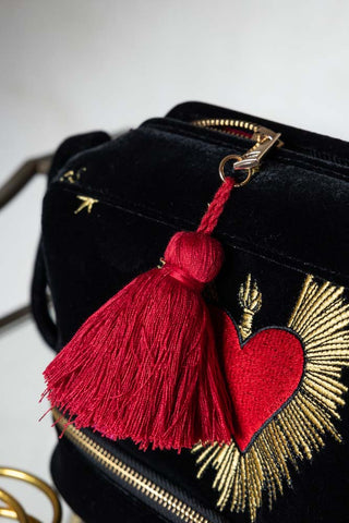 Detail shot of the tassel on the zip of the Black Milagro Heart Velvet Wash Bag.