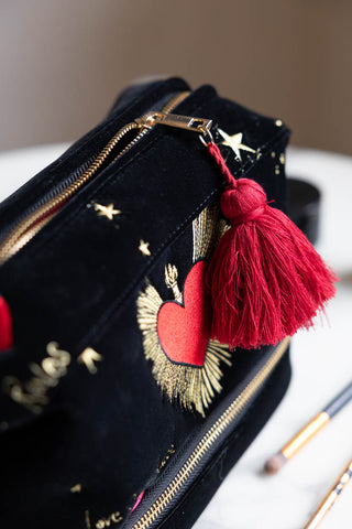 Close-up of the top of the Black Milagro Heart Velvet Wash Bag.