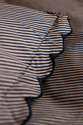 Close-up of the scallop detail on the Black Pencil Stripe Scalloped Edge Bedding Set.