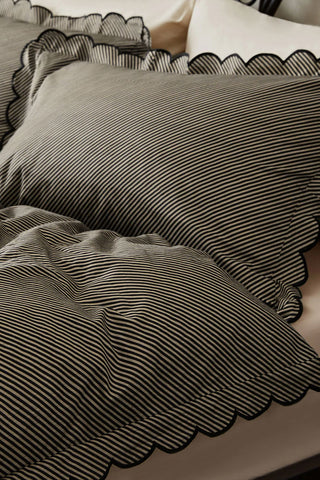 Close-up of the Black Pencil Stripe Scalloped Edge Bedding Set.