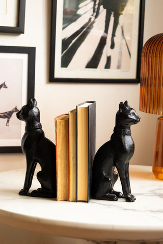 Pair of Black Sitting Cat Bookends with books and orange lamp