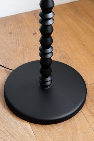 Close-up of the bottom of the Black Wood Spindle Floor Lamp - Base Only.