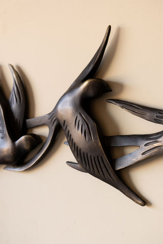 Close-up of the Antiqued Brass Effect Bird Wall Art on a neutral wall.