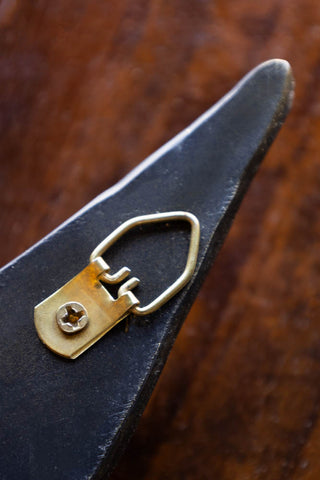 Detail shot of the fixing on the back of the Antiqued Brass Effect Bird Wall Art.