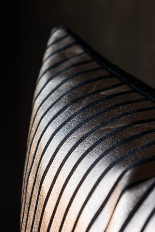 Detail shot of the Black & Gold Striped Cushion.