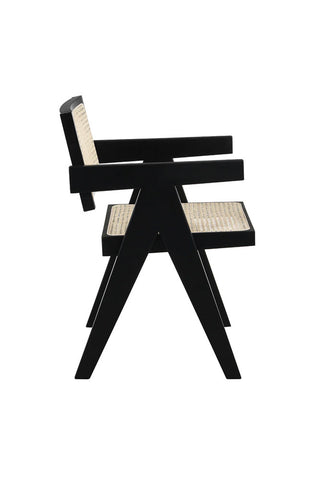 Cutout of the Black & Natural Rattan Statement Chair seen from the side, on a white background.