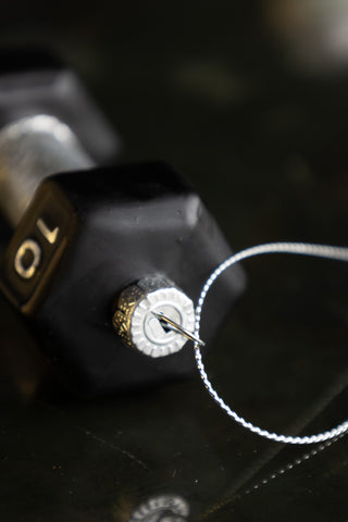 Close-up of the top of the Black Dumbbell Christmas Tree Decoration.