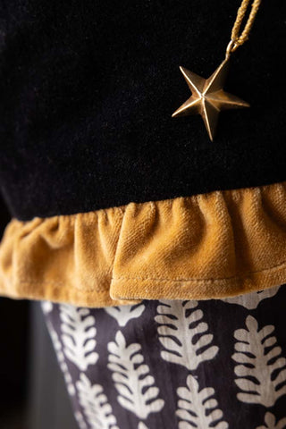 Detail shot of the ruffle and star detail on the Block Print Christmas Stocking.