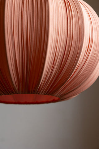 Close-up of the base of the Blush Pleated Fabric Ceiling Light.