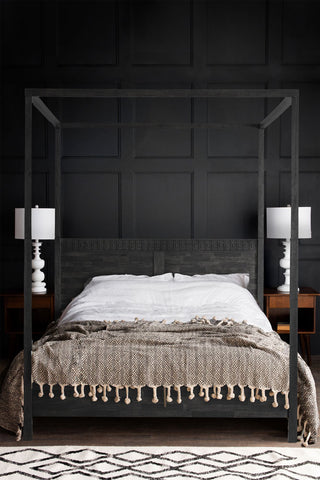 The Boho-Inspired Boutique Four Poster Bed styled in a bedroom with soft furnishings, bedside tables and table lamps.