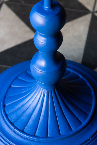 Close-up of the base of the Bold Blue Parrot Floor Lamp with Shade.