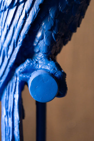 Close-up of the parrot on the perch on the Bold Blue Parrot Floor Lamp with Shade.