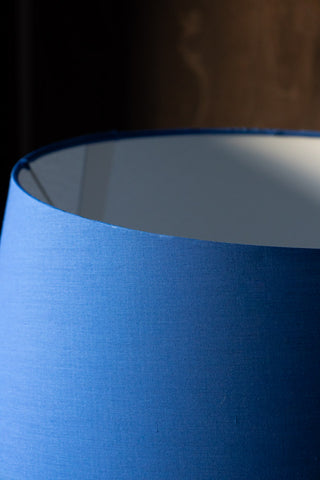 Detail shot of the top of the lampshade on the Bold Blue Parrot Floor Lamp with Shade.