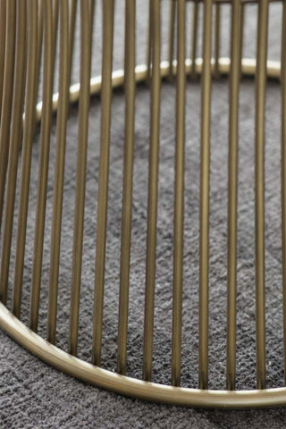 Close-up of the base of the Bronze & Glass Round Dining Table.