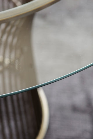 Close-up of the glass of the Bronze & Glass Round Dining Table.