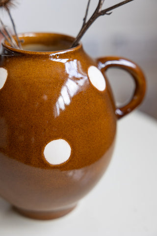 Detail shot of the Brown & Ivory Dotted Display Vase.