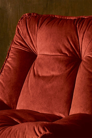 Close-up of the Burnt Orange Velvet Swivel Chair.