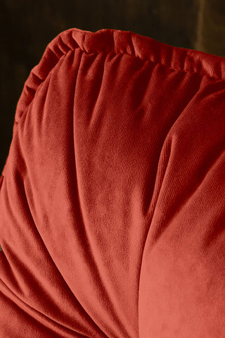 Detail shot of the Burnt Orange Velvet Swivel Chair.