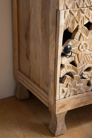 Close-up image of the corner of the Carved Floral Design Wood Bedside Table.