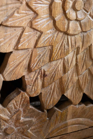 Close-up of the design of the Carved Floral Design Wood Bedside Table.