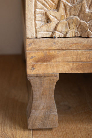 Close-up image of the leg of the Carved Floral Design Wood Bedside Table.