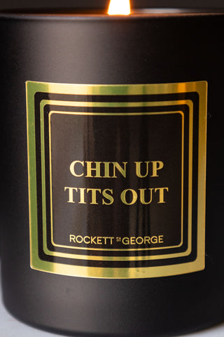 Close-up of the design on the Chin Up, Tits Out Scented Candle.