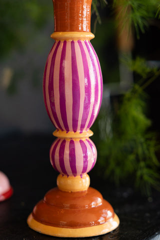 Close-up of the stripe detail and base of the Colourful Candlestick Holder in Pink Stripes.