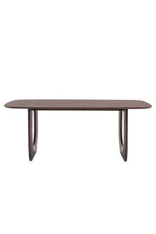 Cutout of the Curved Mango Wood Dining Table on a white background.