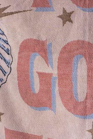 Close-up of the design on the Denim & Bone You Got This Woven Cotton Throw.