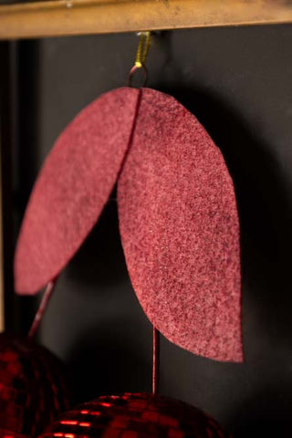 Detail image of the leaf decorations on the Disco Cherries Christmas Tree Decoration.