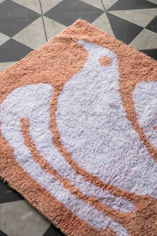 Close-up image of the Dove Tufted Cotton Bath Mat.