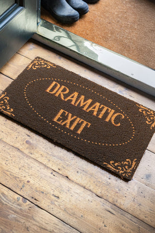 A lifestyle image of the Dramatic Exit Doormat in a hallway