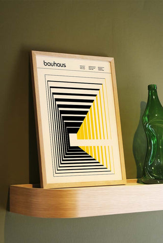 The Dynamics Art Print styled in a frame on a shelf, leaning against the wall.