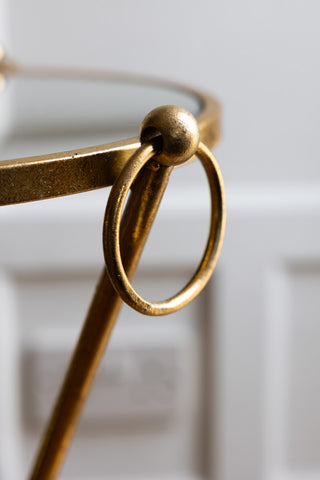 Close-up shot of the side of the Elegant Gold & Glass Side Table.