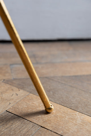 Detail shot of the leg of the Elegant Gold & Glass Side Table.