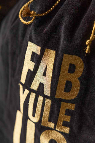 Detail shot of the text and the cord tie on the Fab Yule Us Velvet Christmas Sack.