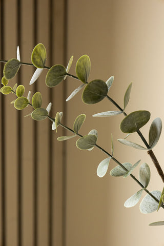 Detail image of the Faux Eucalyptus Plant In Pot agaisnt light background