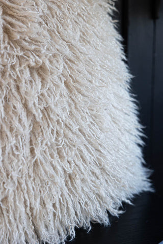 Close-up of the Faux Mongolian Natural Cushion.