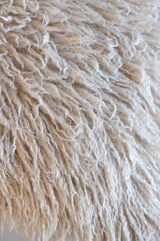 Detail shot of the surface of the Faux Mongolian Natural Cushion.