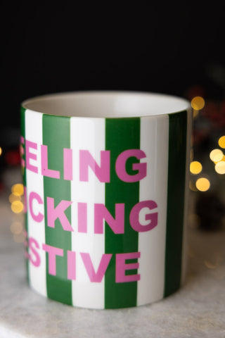 Close-up of the Feeling Fucking Festive Stripe Mug.