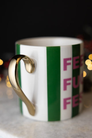 Close-up of the handle on the Feeling Fucking Festive Stripe Mug.