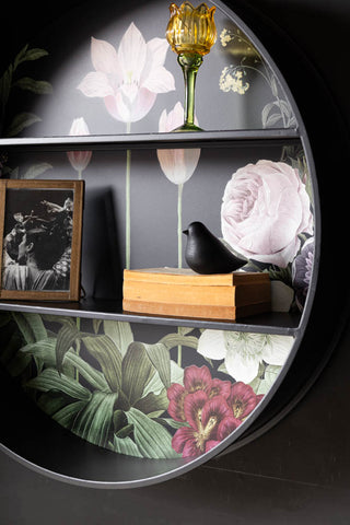 Close-up of the Floral & Black Metal Display Shelves on the wall, with books and ornaments styled on.