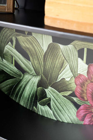 Detail shot of the floral design at the back of the Floral & Black Metal Display Shelves.