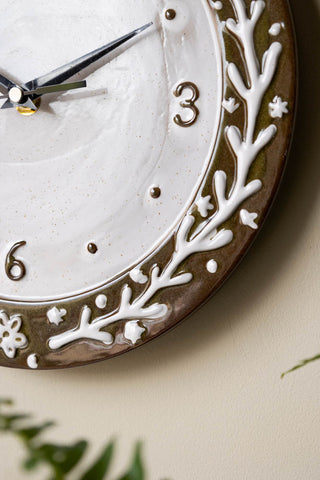 Close-up of the Folk Birds Ceramic Clock on the wall.